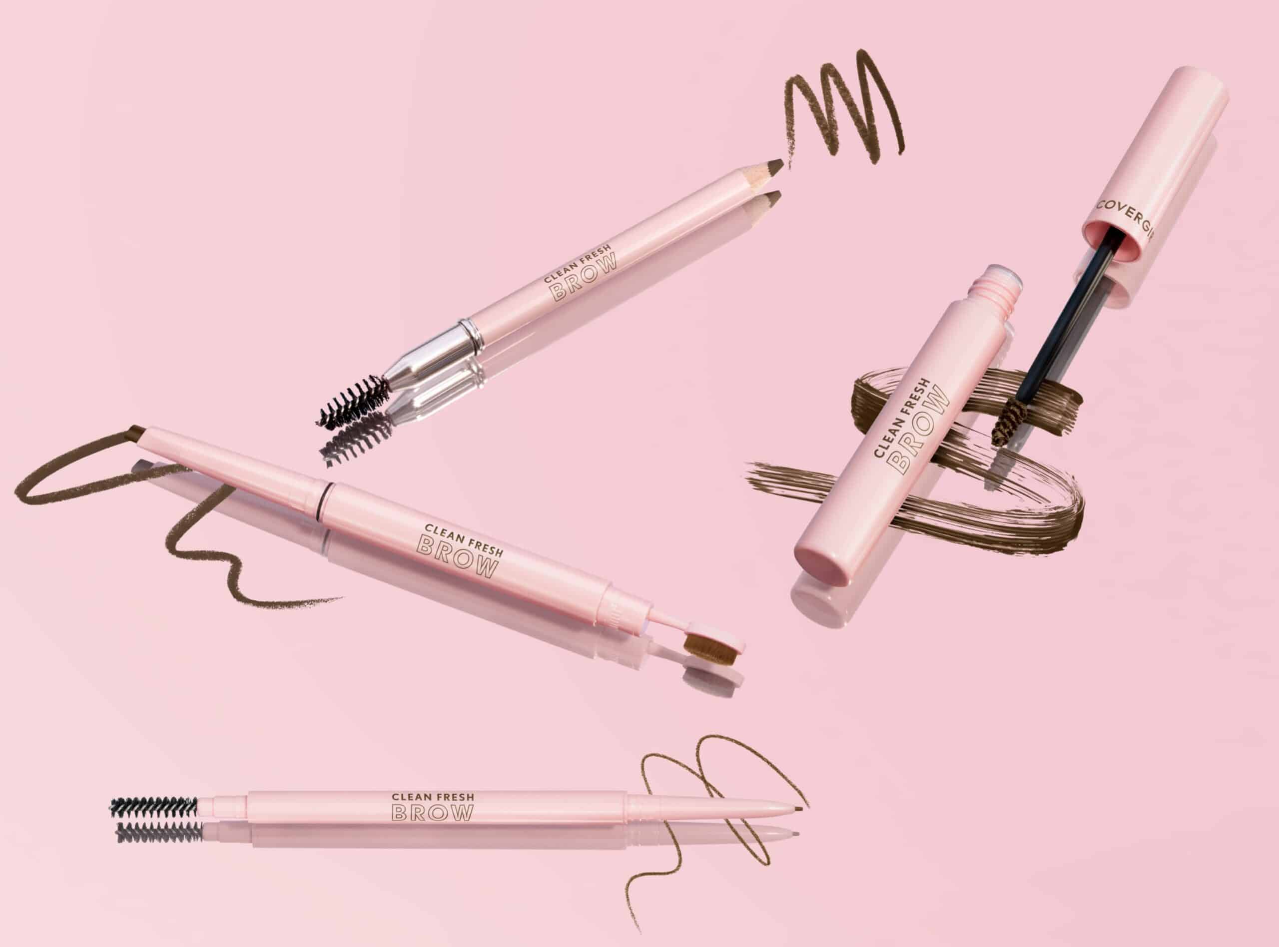 Five pink eyebrow pencils and gels with brushes and brown swatches are arranged on a light pink background.