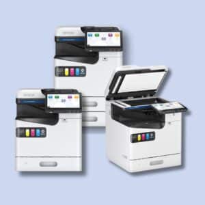 Three Epson multifunction printers are shown; two have closed lids displaying touchscreens, while one has its lid open, revealing the scanning bed.