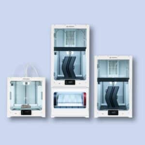 Three Ultimaker 3D printers of different sizes are displayed against a light blue background, each with visible spools and objects being printed inside.