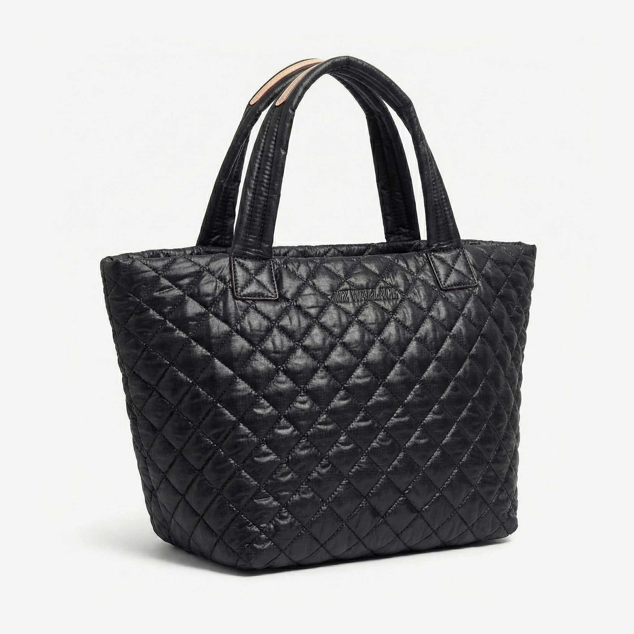 A black quilted tote bag with double handles, displayed on a plain white background.