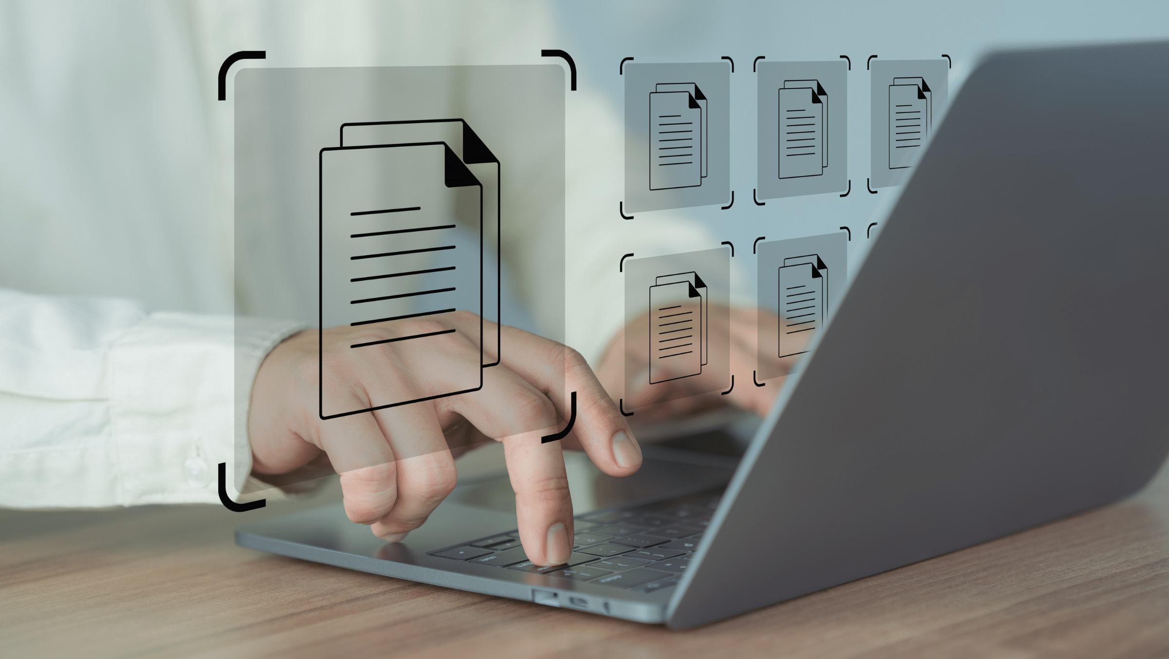 A person uses a laptop with virtual file icons appearing on the screen, suggesting digital document management or file organization.